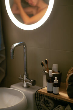 Still life of hygiene items in the bathroom near the mirror. Body and face care.