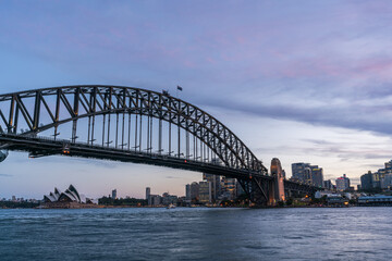 Fototapeta na wymiar Sydney harbor bridge with Sydney CBD downtown skyline at sunset, Sydney, New South Wales, Australia
