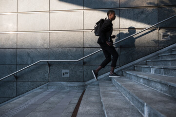 Young businessman walking in the city