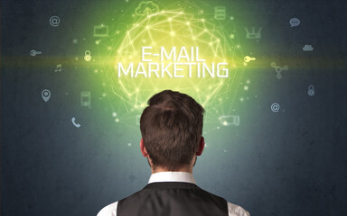 Rear view of a businessman with E-MAIL MARKETING inscription, online security concept