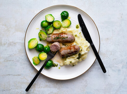 Sausages with mashed potatoes and roasted brussels sprouts