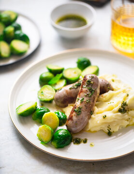 Sausages with mashed potatoes and roasted brussels sprouts