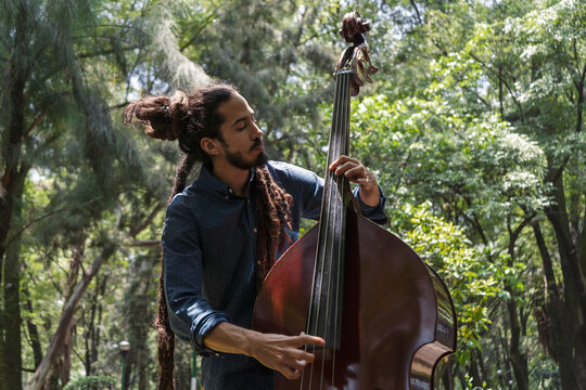 Handsome guy playing double bass
