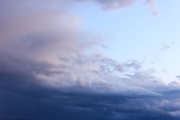 Naklejka na ściany i meble Purple clouds on evening sky at sunset time