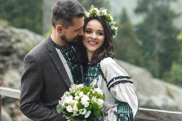 Happy young couple marriage among beautiful nature.