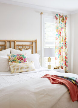 White bedroom with colorful accents