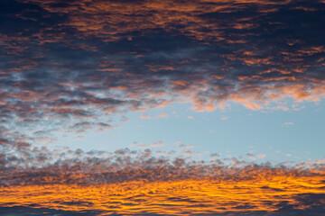 a image of beautiful golden clouds during a sunset in Marbella, Spain