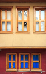 Fototapeta premium Old wooden house. Six wooden windows on wall. 