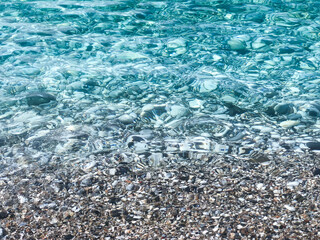 Mediterranean crystal clear sea with pebble sand