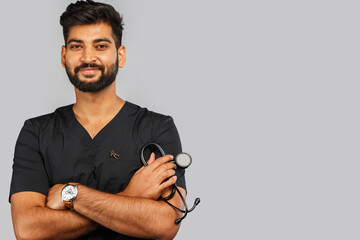 indian doctor or surgeon with stethoscope on gray background
