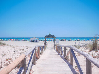 View of the beach and a chiringuito in Cádiz on a sunny day. © Miriam