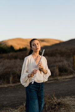 Girl Holding Flute