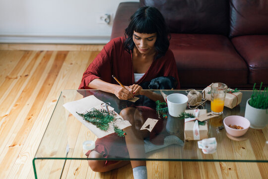 Woman writing Christmas cards