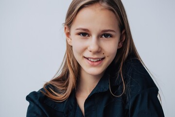 Headshot portrait of charming girl wearing black