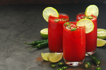 Jalapeno tomato margarita cocktail with lime