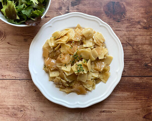 Cabbage with noodles is a meatless main dish. The ingredients are white cabbage, Fleckerl noodles,...