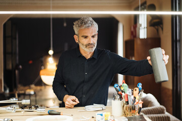 Senior craftsman working in workshop