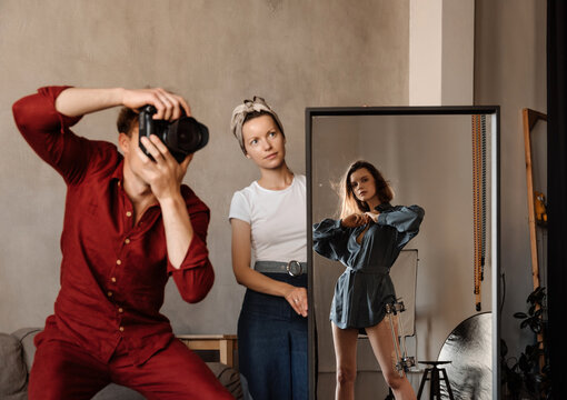 Photographer and assistant taking photos of model with external fixation