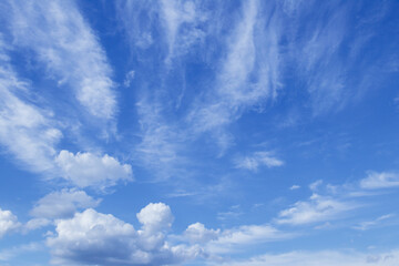 Blue sky with dramatic cumulus clouds.