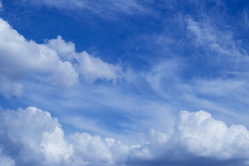 Blue sky with dramatic cumulus clouds.