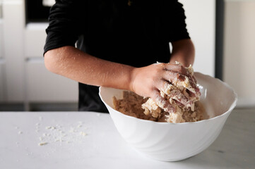 Little girl mixing cookie dough