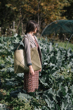 Woman Walking In Green Field