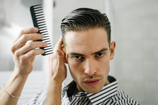 Stylish man stylish hair with comb