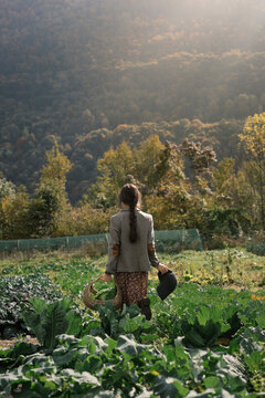 Woman Walking In Green Field