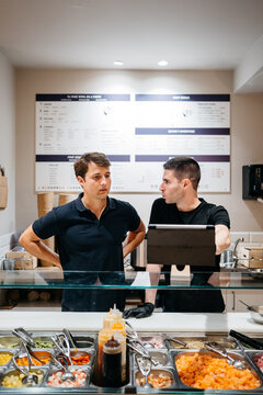 Restaurant young managers are checking the online orders