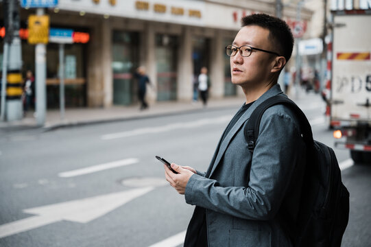 Portrait of businessman using cellphone