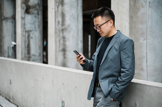 Portrait of businessman using cellphone
