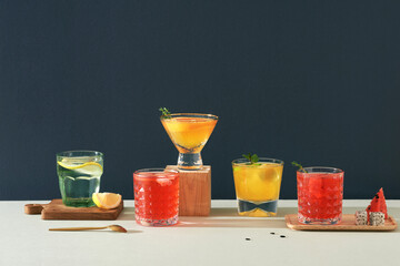 Cocktail mixologist on table and drinks background