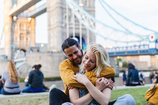 Affectionate couple enjoying the day together along the Thames