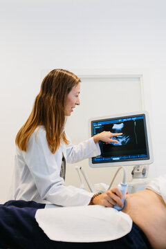 Female doctor performing an ultrasound to a patient