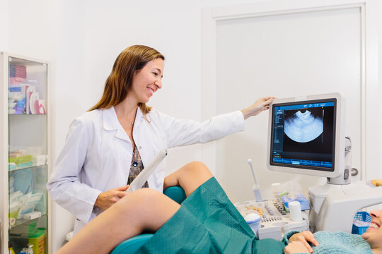 Female doctor performing a vaginal ultrasound to a patient