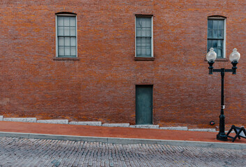 Old brick building and cobblestone street