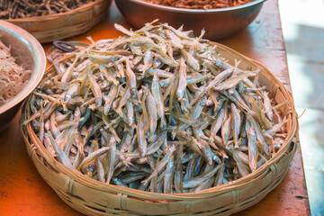 Big pile of fresh Sardines, inside a basket, the market of Dali, Yunnan, China