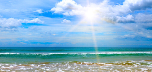 Sea and sun on blue sky background. Wide photo