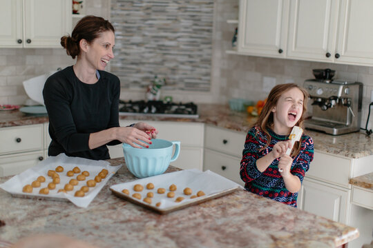 Mother and daughter baking cookies