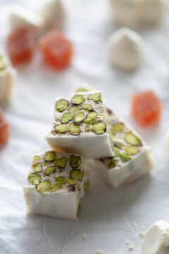 Torrone with pistachio, coconut meringue and grapefruit jelly cube