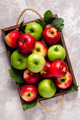 Naklejka na ściany i meble Ripe red and green apples in wooden box.