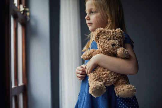 Child holding a teddy bear
