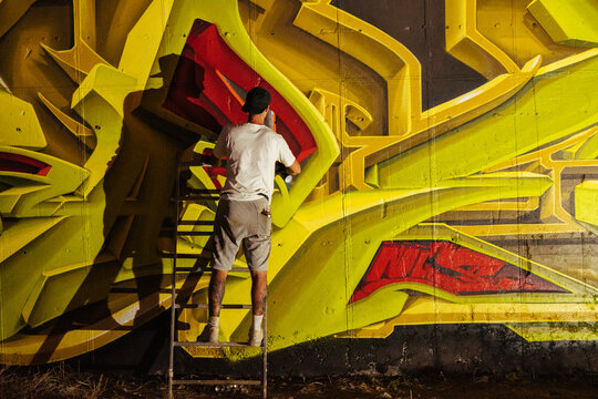 Graffiti artist painting