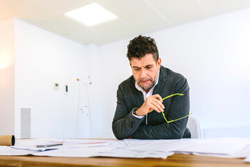 Mature male working on paper draft