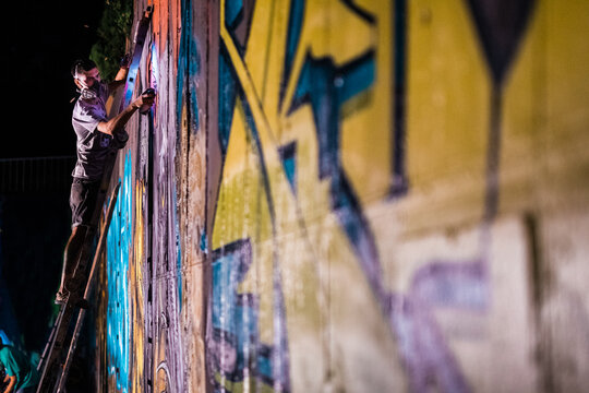 Graffiti artist painting
