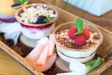 beautuful desserts on a wooden tray
