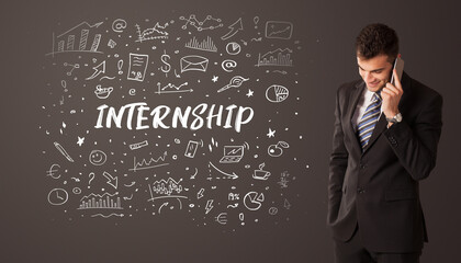 Businessman thinking with INTERNSHIP inscription, business education concept