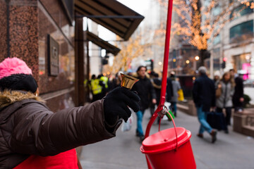 Salvation Army worker ringing the bell in downtown Chicago