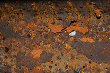 Rusty surface of metal old structure in orange and brown colors