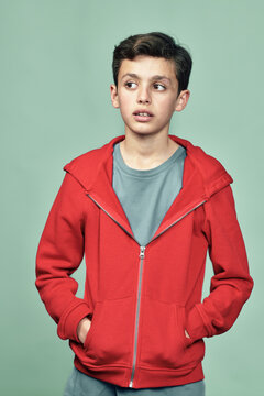 Studio portrait of boy in red jacket